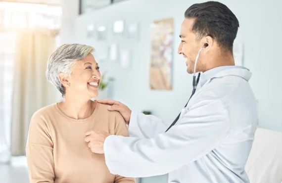 A doctor discussing medical treatment with an elderly patient.