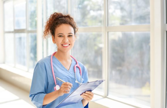 triage nurse standing in hospital hallway