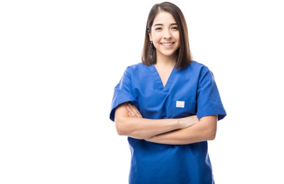 Pretty young nurse with arms crossed