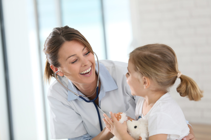 doctor with little girl